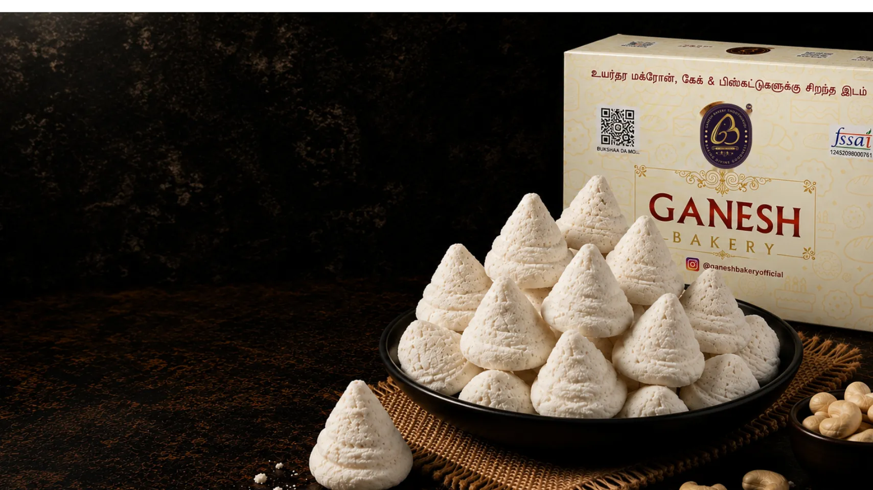A plate of Thoothukudi macroons beside a Ganesh Bakery gift box
